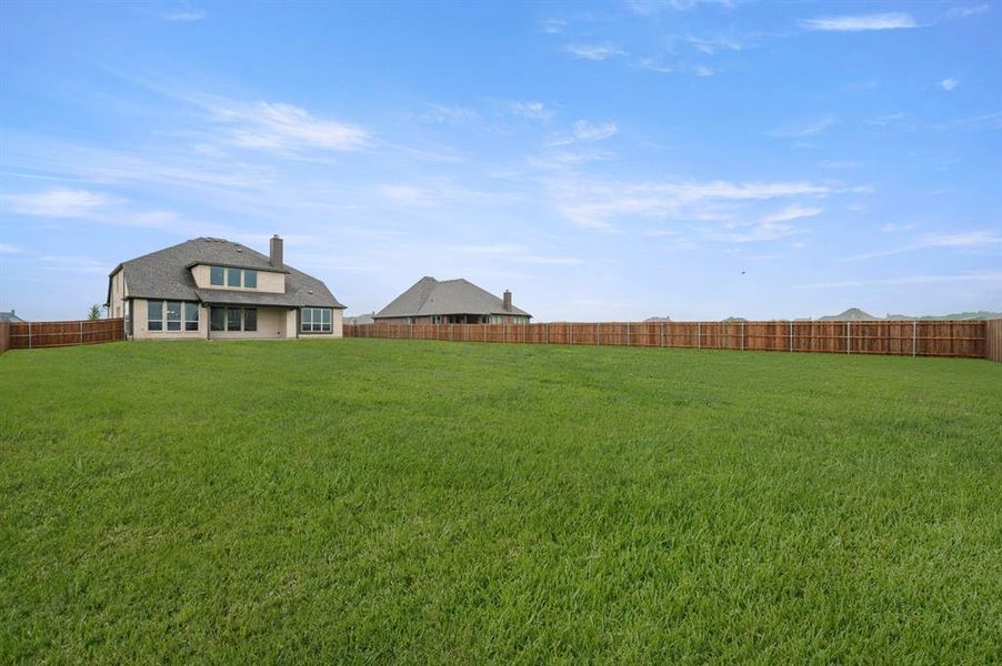Exterior details and patio area of a home in Coyote Crossing, Godley (Image 4).