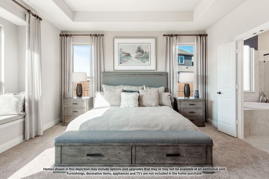 Master bedroom with king bed, storage drawers, nightstands, and ensuite bathroom entrance visible on right Master bedroom with king bed, storage drawers, nightstands, and ensuite bathroom entrance visible on right
