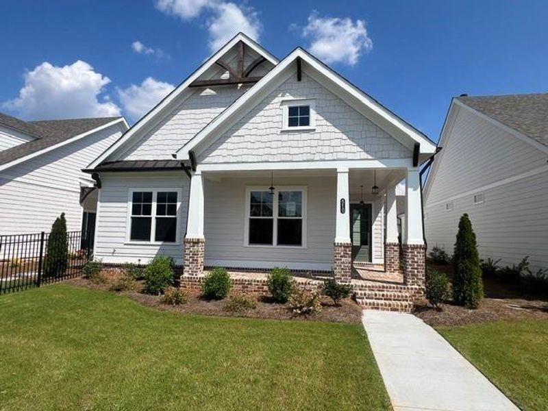Front exterior of a new home in Promenade at Sawnee Village, Cumming, GA, highlighting curb appeal (Image 19).