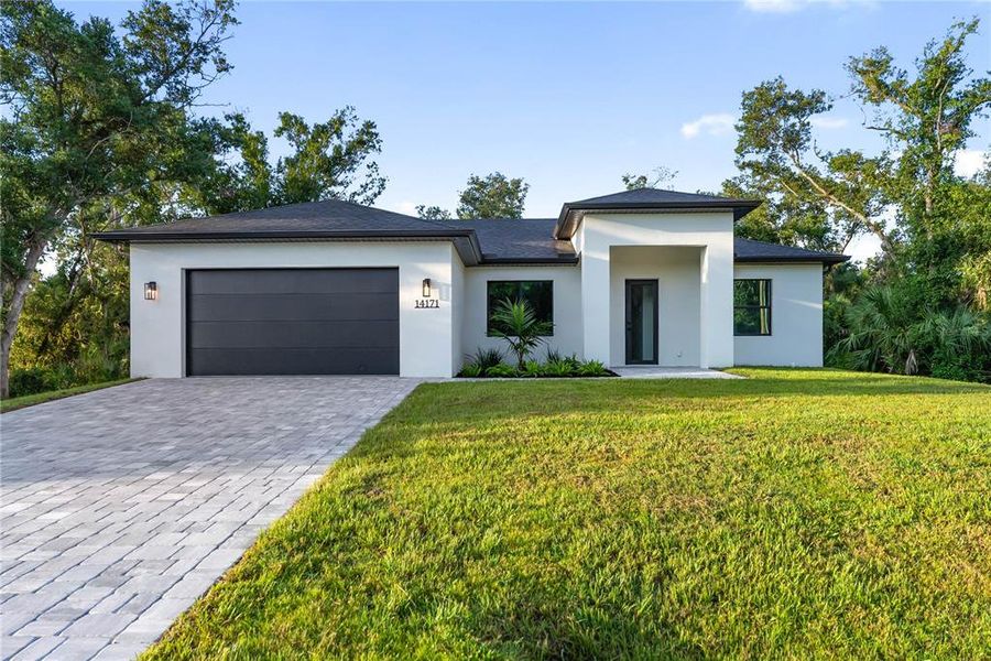Front exterior of a new home in , Port Charlotte, FL, highlighting curb appeal (Image 30).