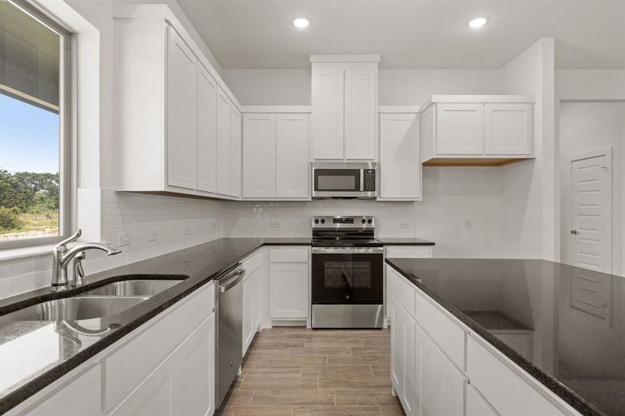 Furnished interior view inside a new home in Saddleback Estates, Boyd (Image 7).