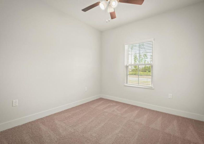 The secondary bedrooms are large and include ceiling fans.