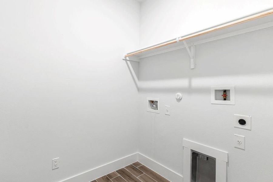Ready for appliances, this utility room features functional hookups and durable tile flooring. Ready for appliances, this utility room features functional hookups and durable tile flooring.
