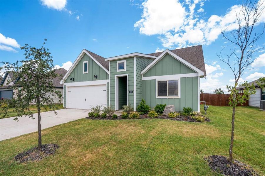 Front exterior of a new home in Windrose, Pilot Point, TX, highlighting curb appeal (Image 20). Front exterior of a new home in Windrose, Pilot Point, TX, highlighting curb appeal (Image 20).