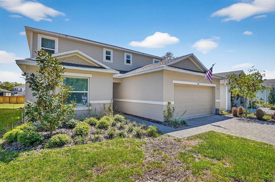 Front exterior of a new home in Riverfront, Edgewater, FL, highlighting curb appeal (Image 25).