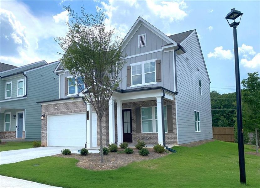 Front exterior of a new home in , Lilburn, GA, highlighting curb appeal (Image 29).