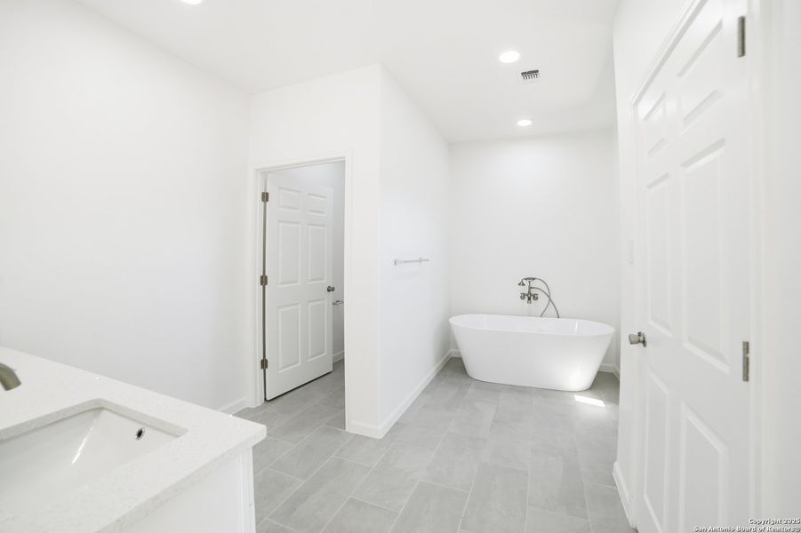 Furnished interior view inside a new home in , Lakehills (Image 10).