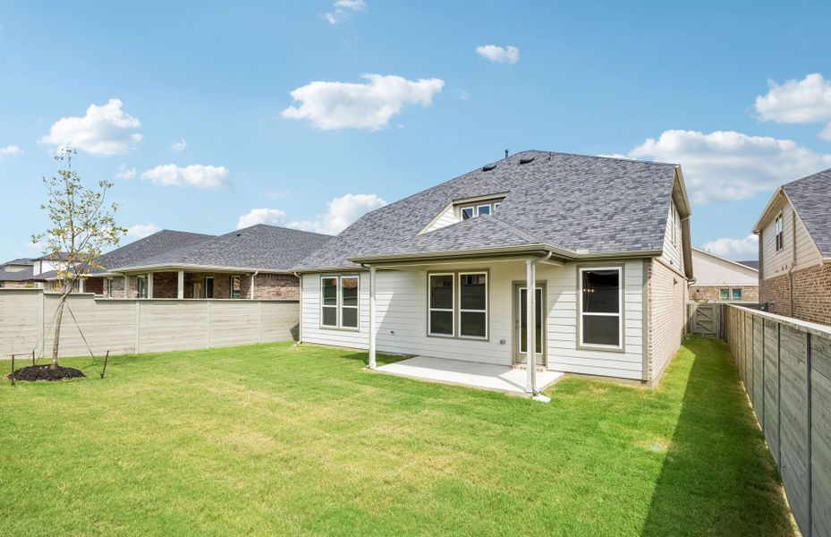 Exterior details and patio area of a home in Treeline, Justin (Image 2).