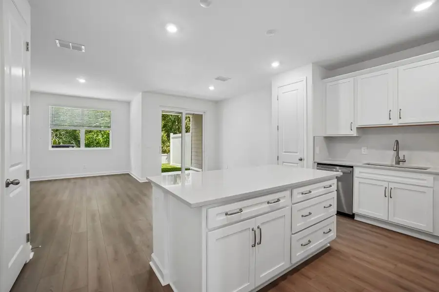 As you walk down the foyer you are welcome into the open concept kitchen, family and dining spaces