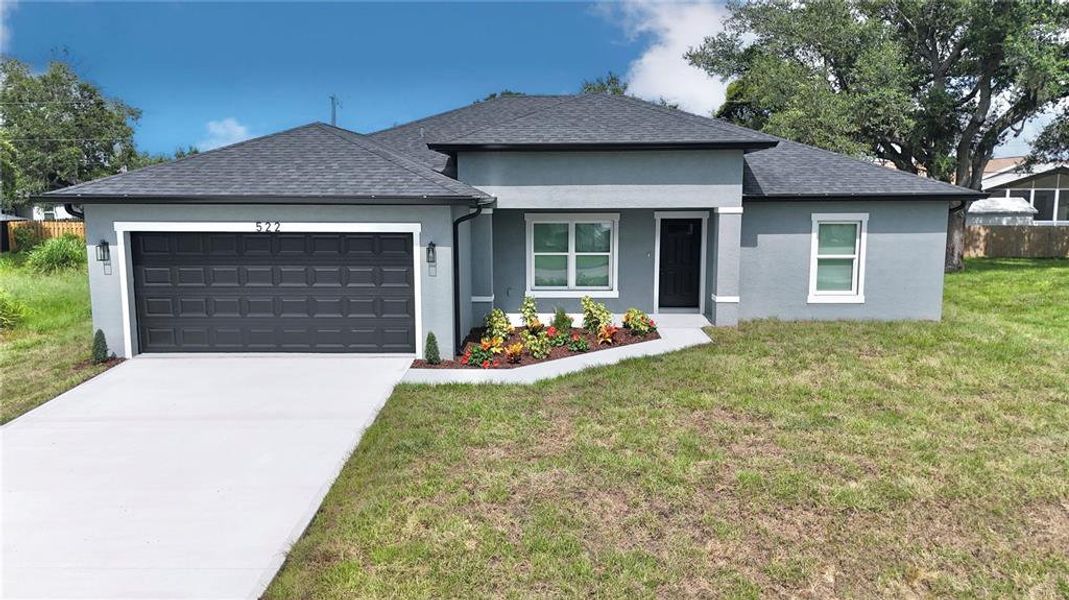 Front exterior of a new home in , Port Charlotte, FL, highlighting curb appeal (Image 24).