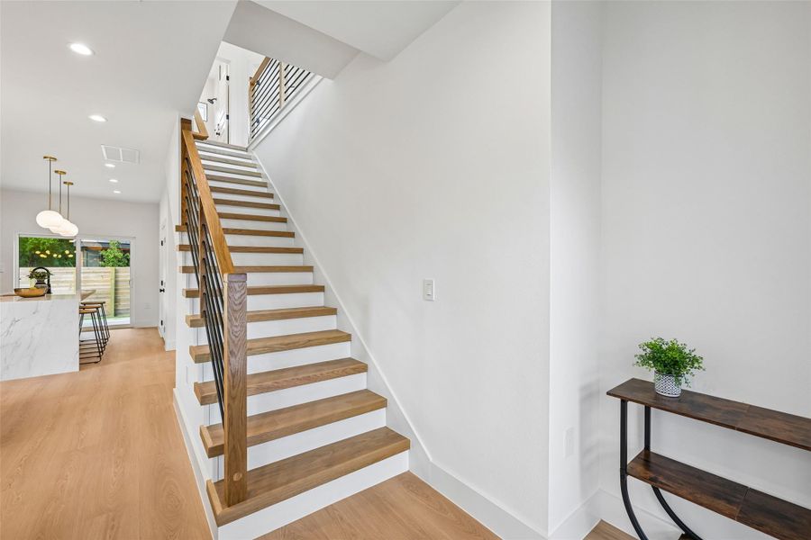 Clean lines and a striking staircase lead to the next level of modern living.