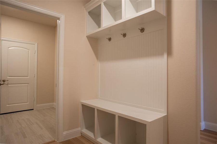 Mudroom with light wood-type flooring