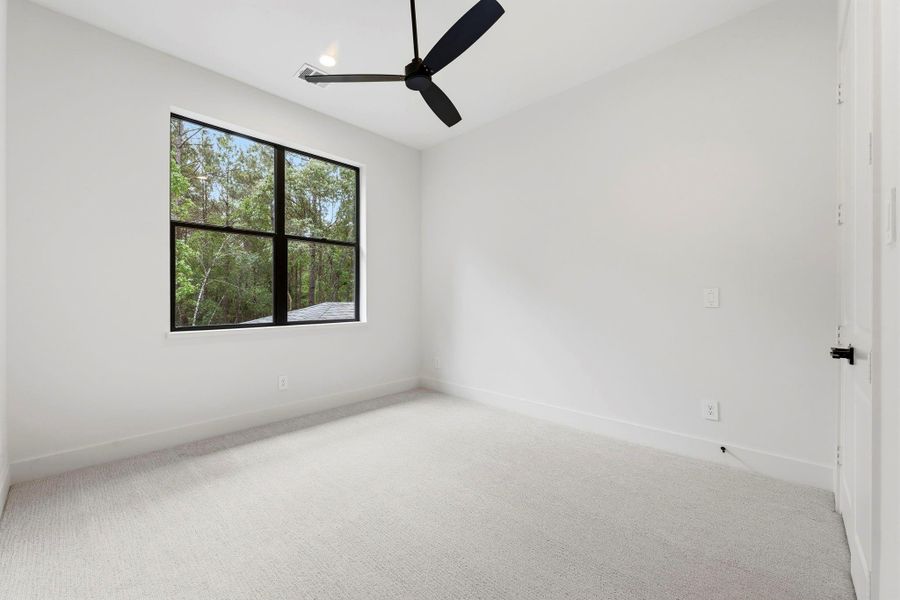 Bedroom #4 (Located Upstairs) Painted Light and BRIGHT, PLUSH carpet, and black ceiling fan!