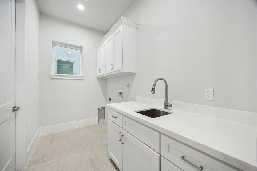 Utility room - located on the second floor with an access from both primary suite and hallway. Utility room - located on the second floor with an access from both primary suite and hallway.