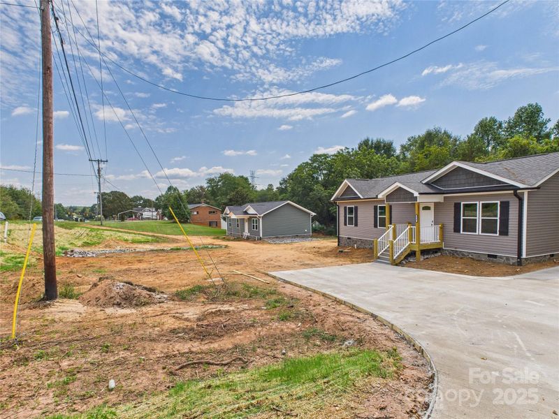 Front exterior of a new home in , Connelly Springs, NC, highlighting curb appeal (Image 22). Front exterior of a new home in , Connelly Springs, NC, highlighting curb appeal (Image 22).