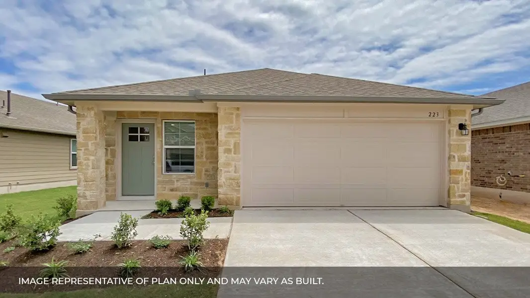 Front exterior of a new home in Carillon, Manor, TX, highlighting curb appeal (Image 1). Front exterior of a new home in Carillon, Manor, TX, highlighting curb appeal (Image 1).