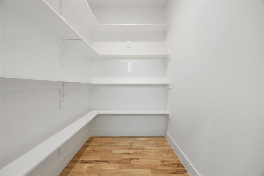 The oversized walk-in pantry offers exceptional storage with ample space for dry goods, small appliances, cookware, and all of your everyday kitchen essentials. Thoughtfully designed for both organization and convenience, it keeps everything within easy reach while maintaining a clean, clutter-free kitchen. The oversized walk-in pantry offers exceptional storage with ample space for dry goods, small appliances, cookware, and all of your everyday kitchen essentials. Thoughtfully designed for both organization and convenience, it keeps everything within easy reach while maintaining a clean, clutter-free kitchen.