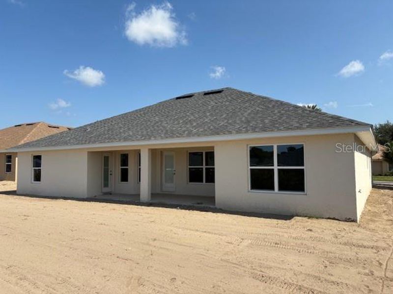 Front exterior of a new home in Juliette Falls, Dunnellon, FL, highlighting curb appeal (Image 12).