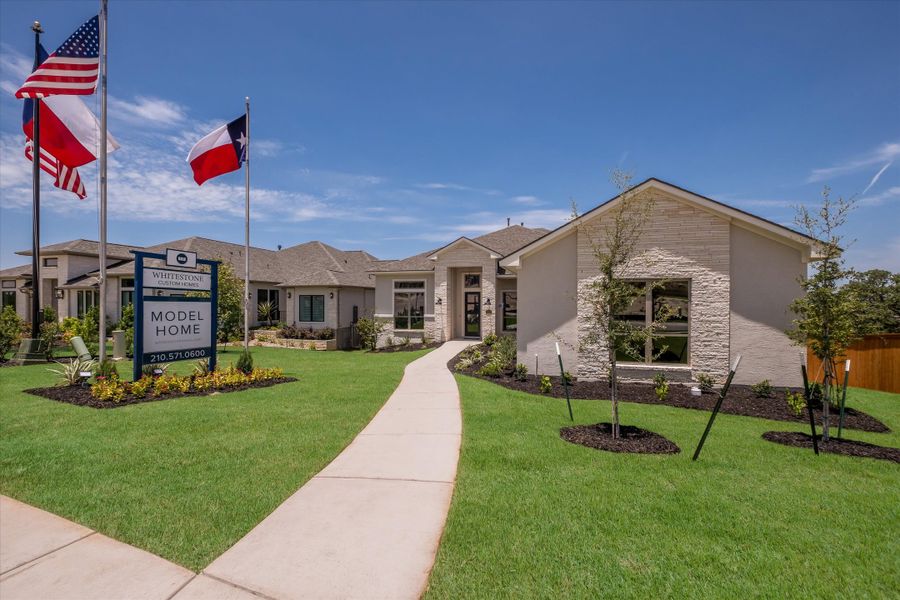 Front exterior of a new home in Johnson Ranch, Bulverde, TX, highlighting curb appeal (Image 1).