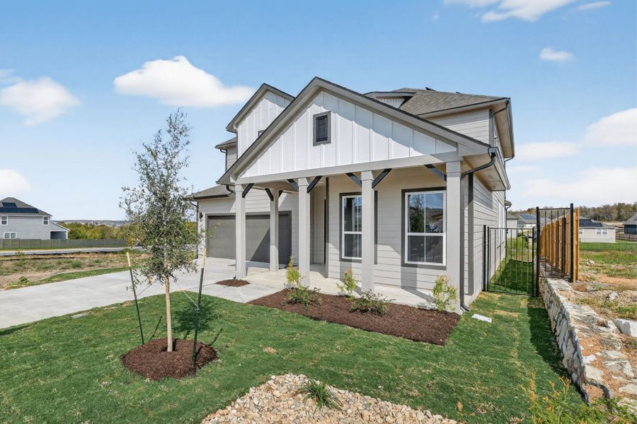 Front exterior of a new home in Whisper Valley, Manor, TX, highlighting curb appeal (Image 19).