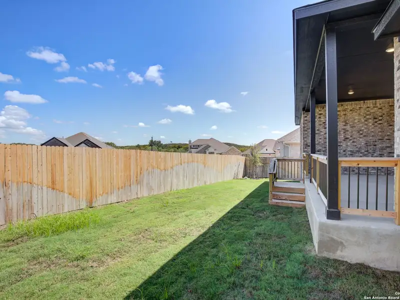 Exterior details and patio area of a home in The Reserve at Potranco Oaks, Castroville (Image 4).