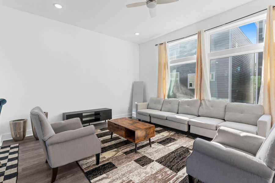 Bright living area filled with natural light and modern finishes. Bright living area filled with natural light and modern finishes.