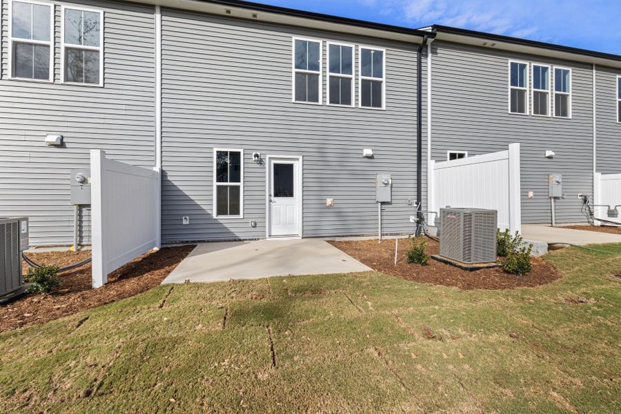 Exterior details and patio area of a home in Poets Walk, Whitsett (Image 3).