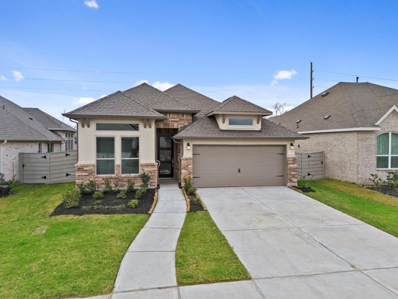 Front exterior of a new home in Pomona, Manvel, TX, highlighting curb appeal (Image 19).