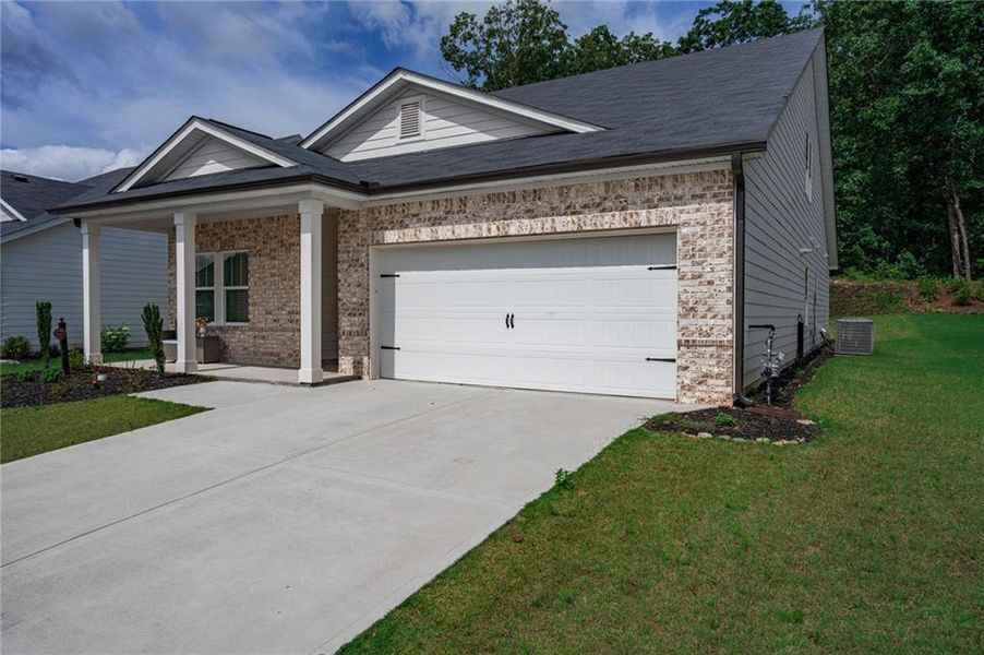Front exterior of a new home in , Canton, GA, highlighting curb appeal (Image 26).