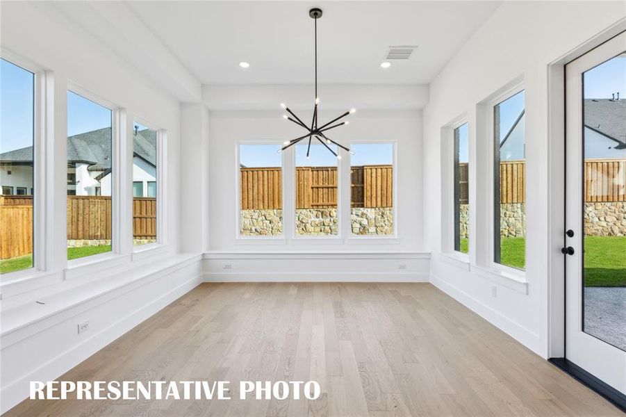 With windows everywhere you look, this dream dining room is the perfect place to host grand dinner parties or cozy family get togethers.  REPRESENTATIVE PHOTO