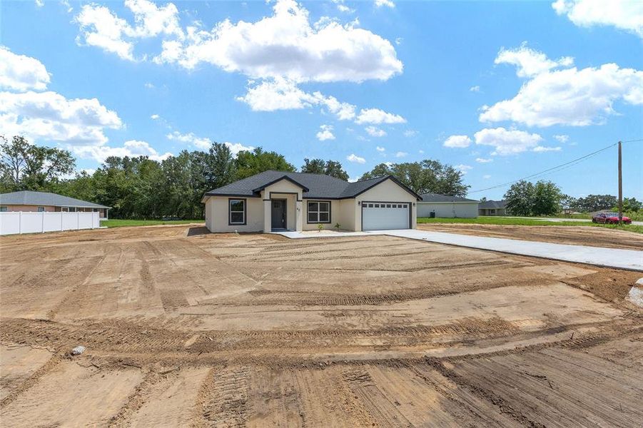 Front exterior of a new home in , Ocala, FL, highlighting curb appeal (Image 36). Front exterior of a new home in , Ocala, FL, highlighting curb appeal (Image 36).