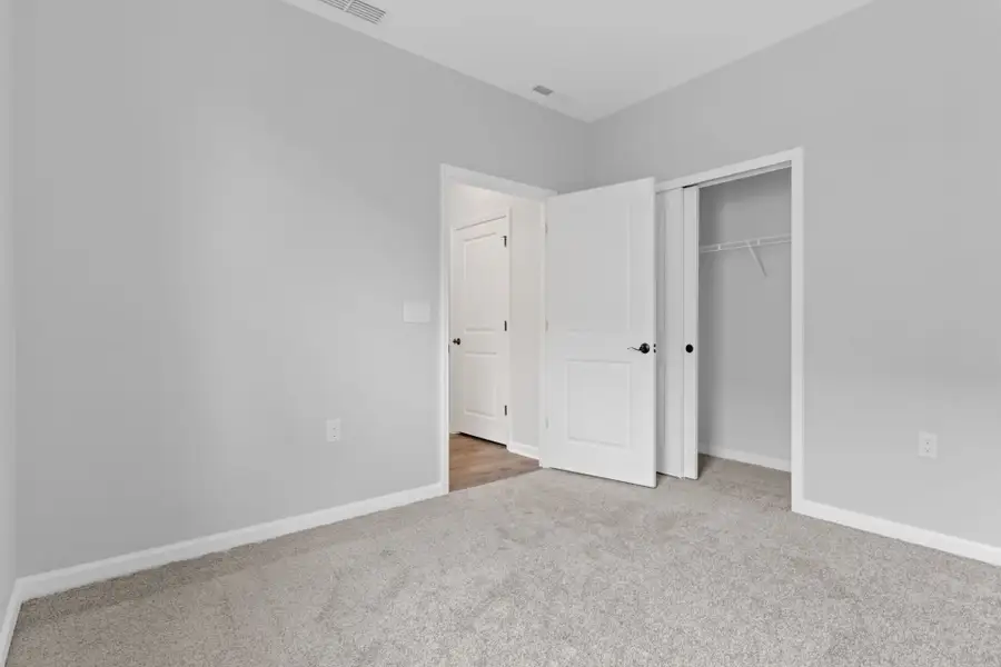 Representative unfurnished interior of a home built from the Alpine by Del Webb in Del Webb Ocean Isle Beach, Shallotte (Image 17).