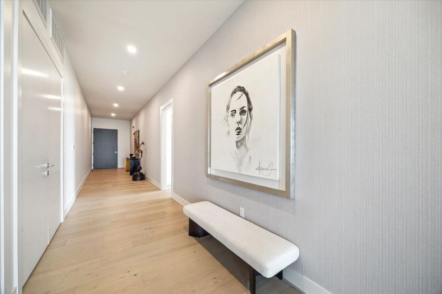 Well positioned walls at the entry to display and appreciate your art collection.