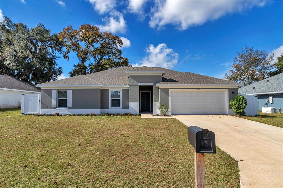 Front exterior of a new home in Diamond Ridge, Belleview, FL, highlighting curb appeal (Image 18).