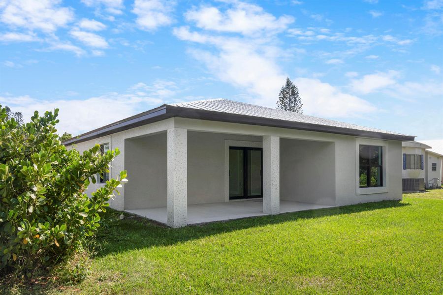 Front exterior of a new home in , Port St. Lucie, FL, highlighting curb appeal (Image 2).