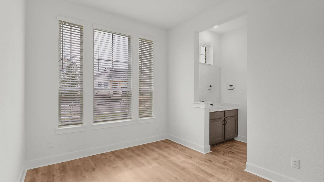 Representative unfurnished interior of a home built from the Drios by Chesmar Homes in Crescent Bluff, Georgetown (Image 13).