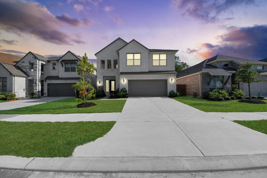 This photo showcases a modern two-story home with a brick facade, double garage, and well-maintained front yard. The house is set in a suburban neighborhood with similar homes, under a picturesque evening sky. This photo showcases a modern two-story home with a brick facade, double garage, and well-maintained front yard. The house is set in a suburban neighborhood with similar homes, under a picturesque evening sky.
