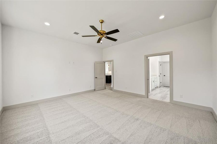 Unfurnished bedroom featuring light carpet, recessed lighting, and ceiling fan