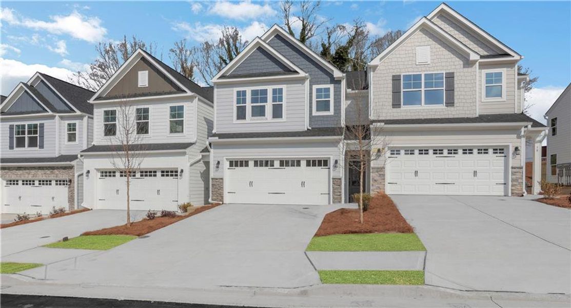 Front exterior of a new home in Villas at Dawsonville Townhomes, Dawsonville, GA, highlighting curb appeal (Image 20).