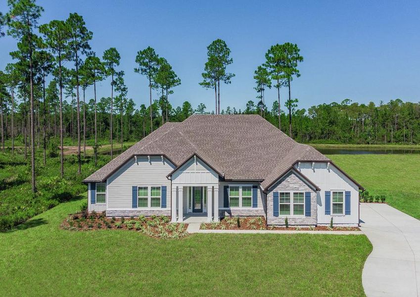 The front exterior of the Mantle showcases siding, stone accents, shutters, gables and landscaping.