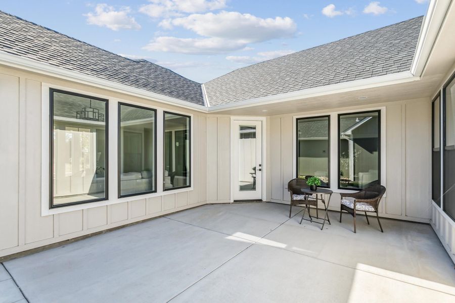 Exterior details and patio area of a home in The Courtyards at The Moorings, Wichita (Image 3).