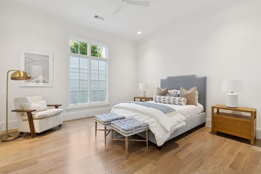 Bedroom with crown molding, light wood-style flooring, a ceiling fan, and recessed lighting