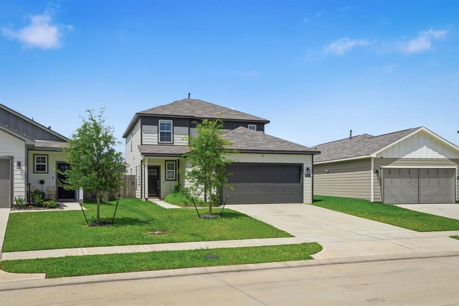 Front exterior of a new home in Paloma at Sanford Farms, Waller, TX, highlighting curb appeal (Image 25). Front exterior of a new home in Paloma at Sanford Farms, Waller, TX, highlighting curb appeal (Image 25).