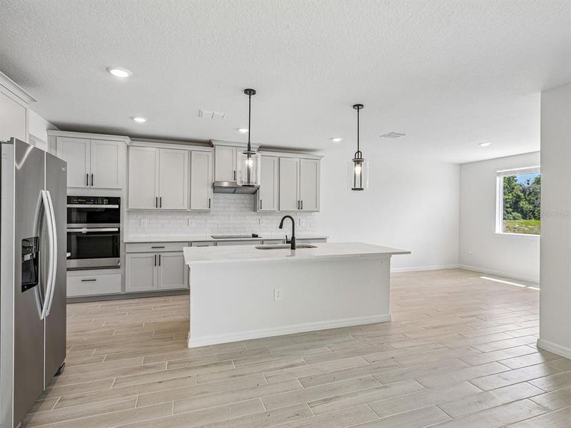 Furnished interior view inside a new home in Two Rivers - Signature Series, Zephyrhills (Image 3).
