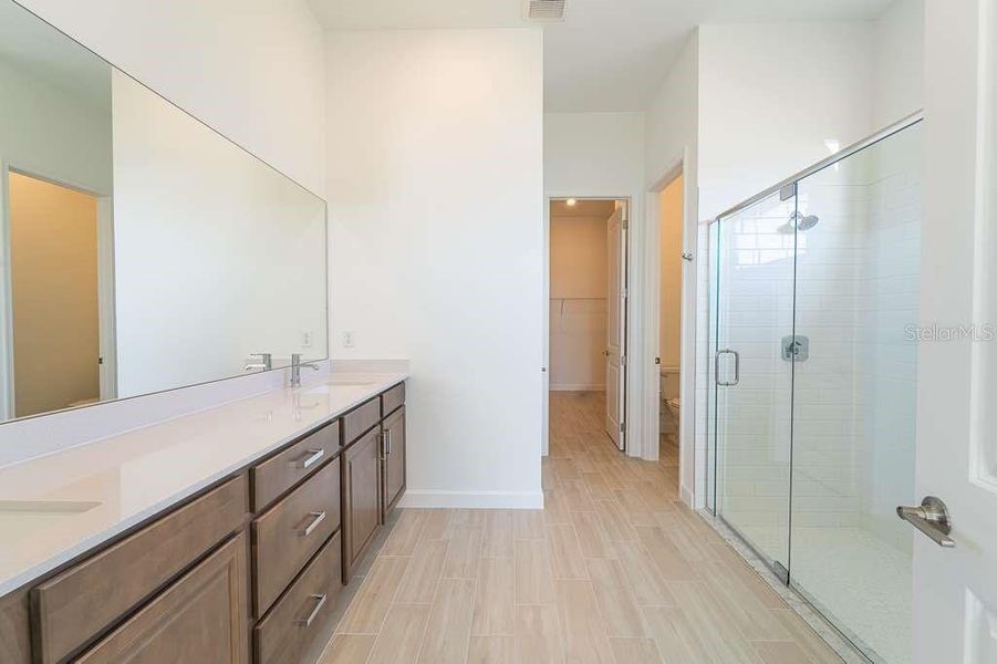Furnished interior view inside a new home in Tesoro Club, Port St. Lucie (Image 12).