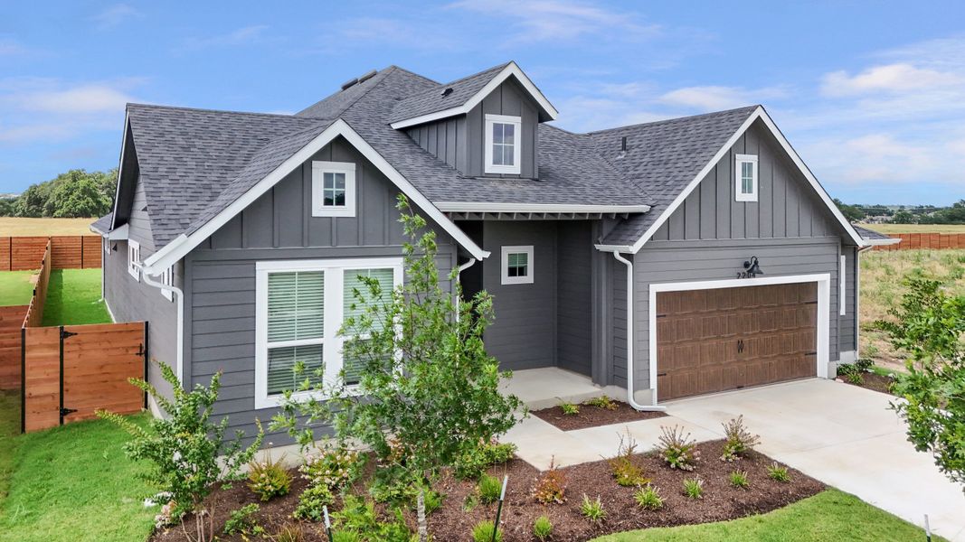 Front exterior of a new home in Highland Village, Georgetown, TX, highlighting curb appeal (Image 23). Front exterior of a new home in Highland Village, Georgetown, TX, highlighting curb appeal (Image 23).