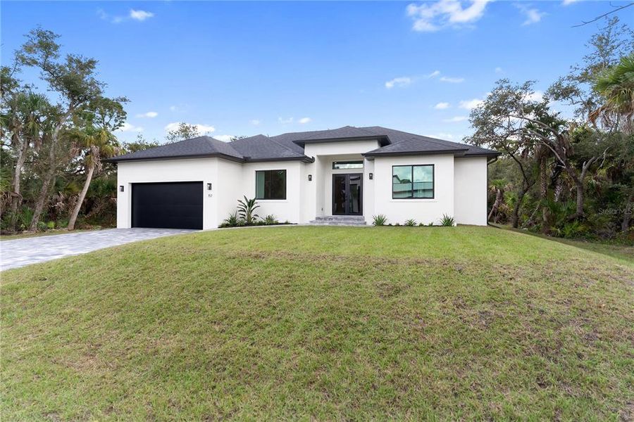 Front exterior of a new home in , Port Charlotte, FL, highlighting curb appeal (Image 36).