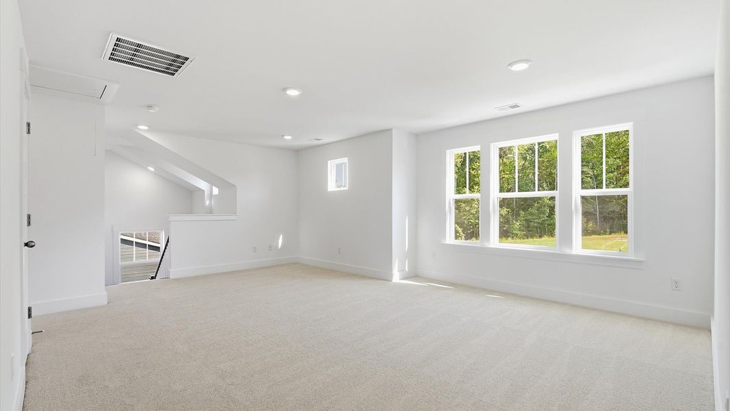 First-class loft design with comfortable carpeting and a thoughtful layout at the highly sought after Pinebrook community