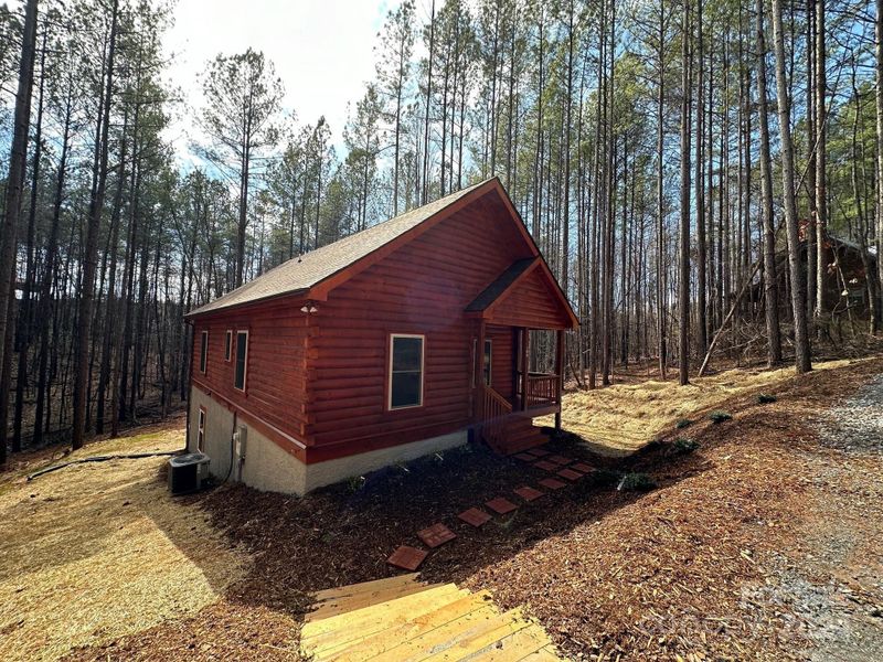 Front exterior of a new home in , Rutherfordton, NC, highlighting curb appeal (Image 1).