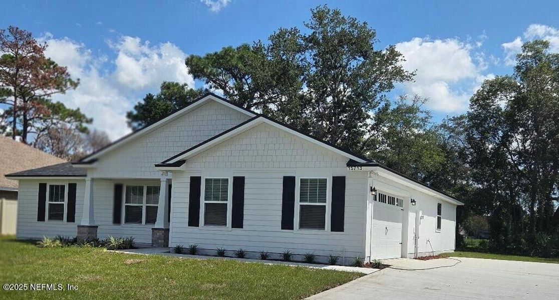 Front exterior of a new home in , Jacksonville, FL, highlighting curb appeal (Image 20). Front exterior of a new home in , Jacksonville, FL, highlighting curb appeal (Image 20).